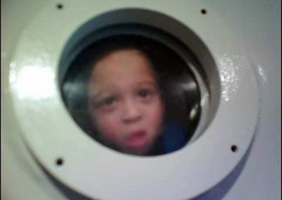 child-looking-through-hbot-window